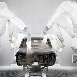 Body-in-white inside a paint spray booth