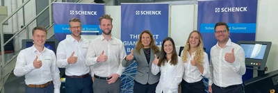 Schenck employees giving thumbs up