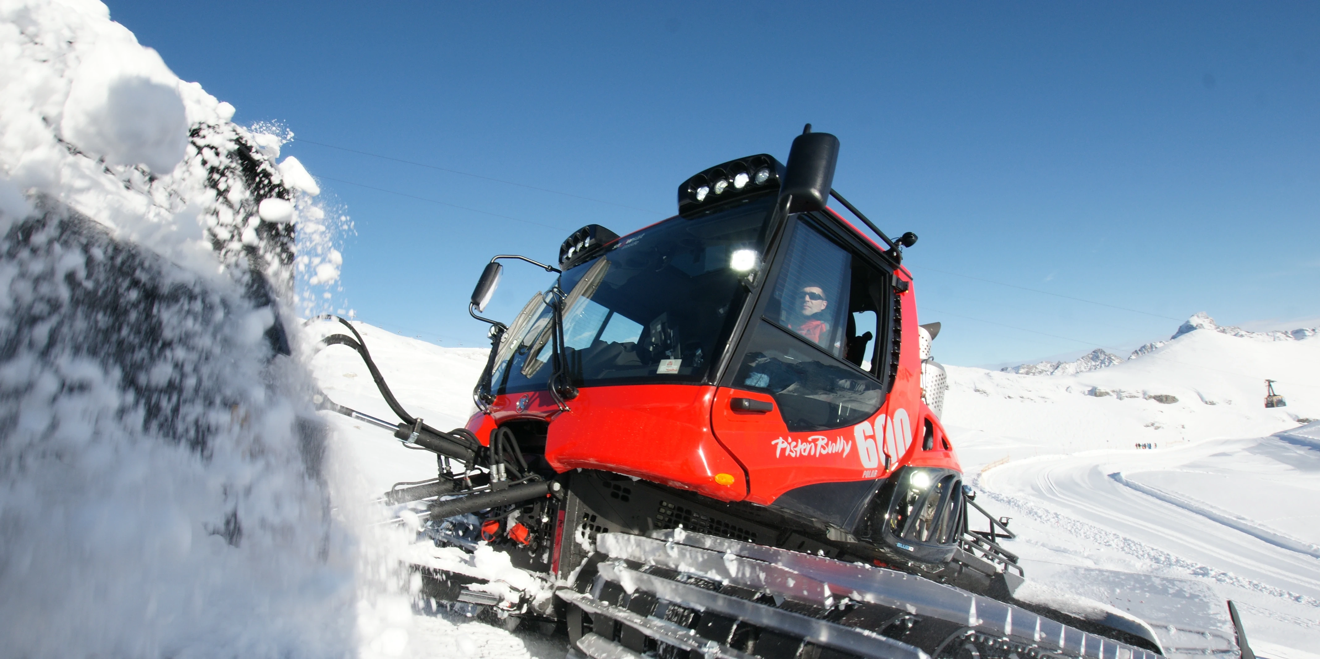 snow groomer in action