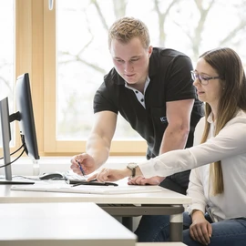Vocational training apprentices working on a computer