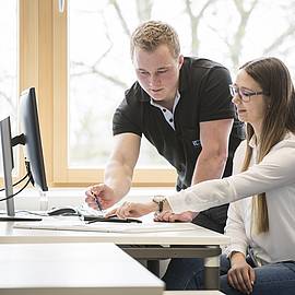 apprentices working on a computer