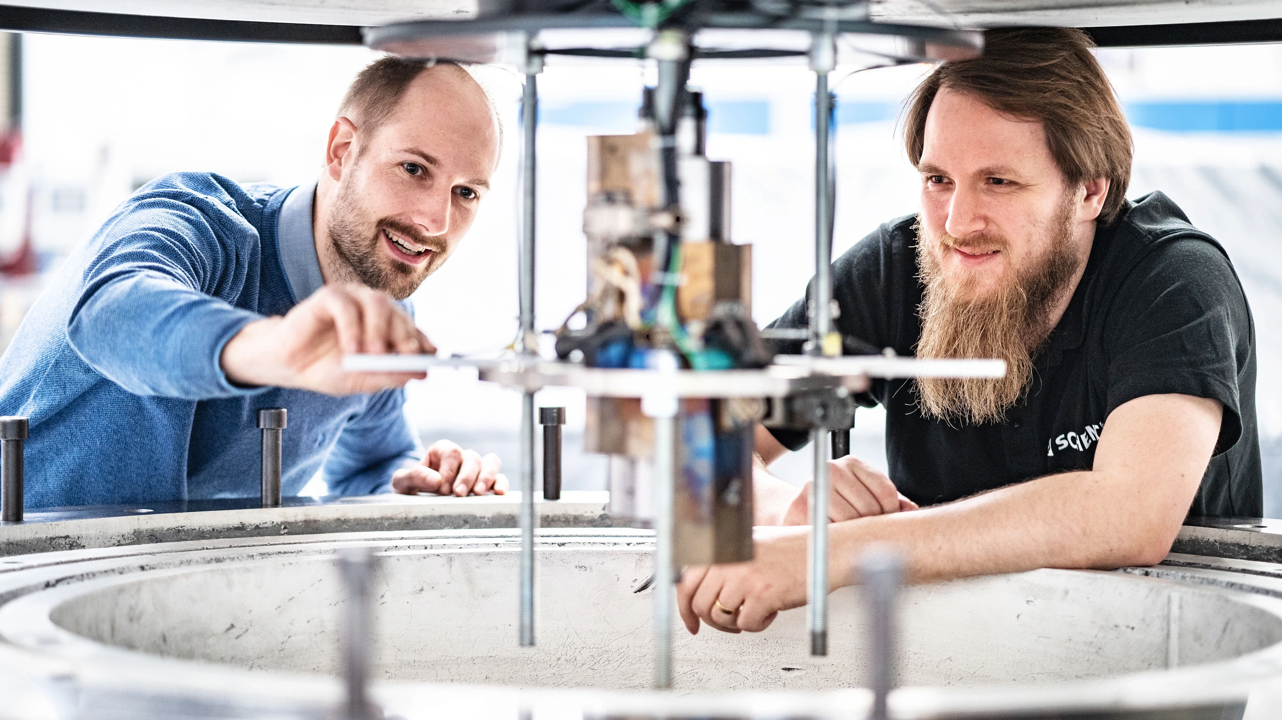 employees working on spin test system