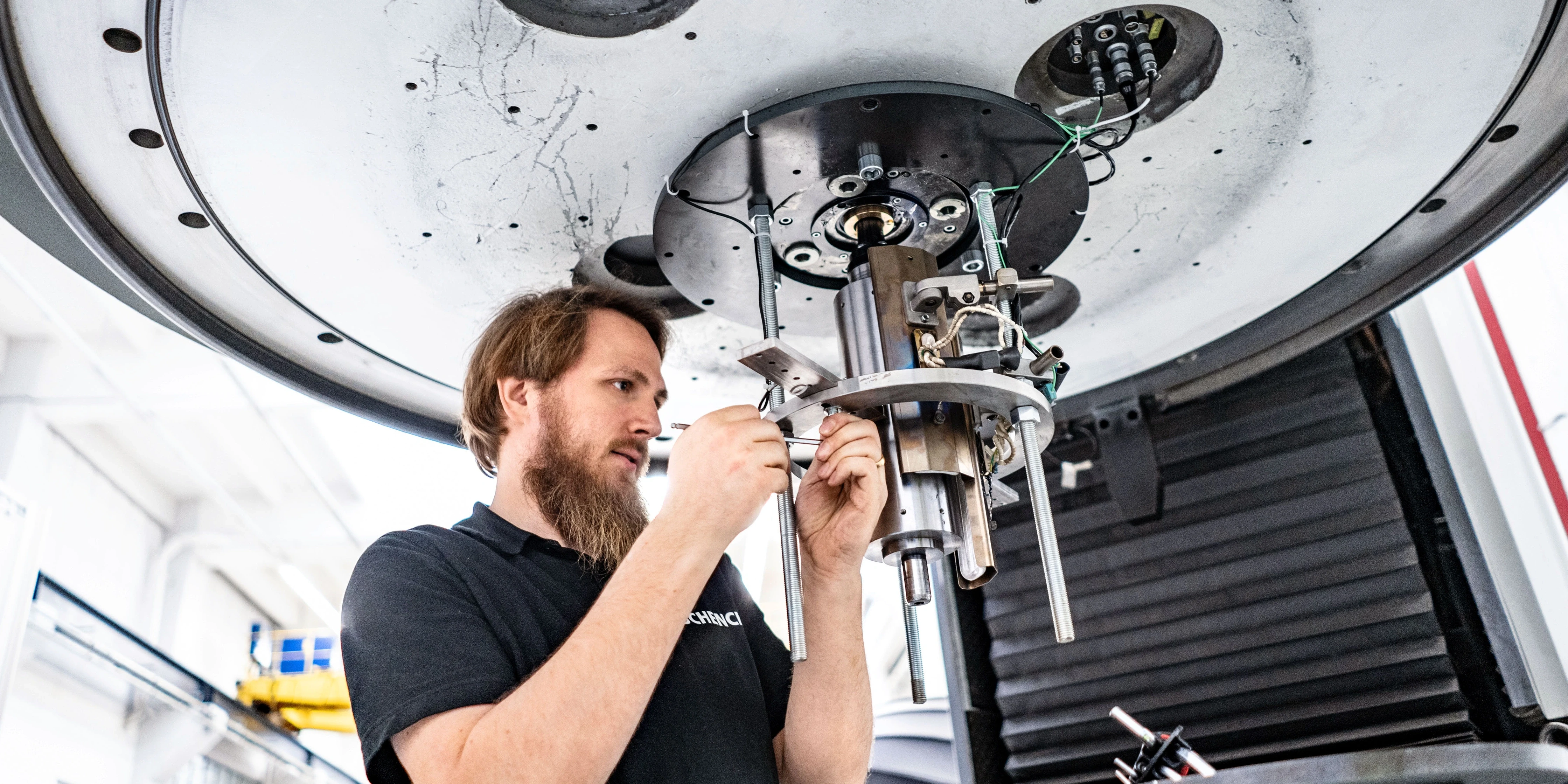 employee working on spin test system