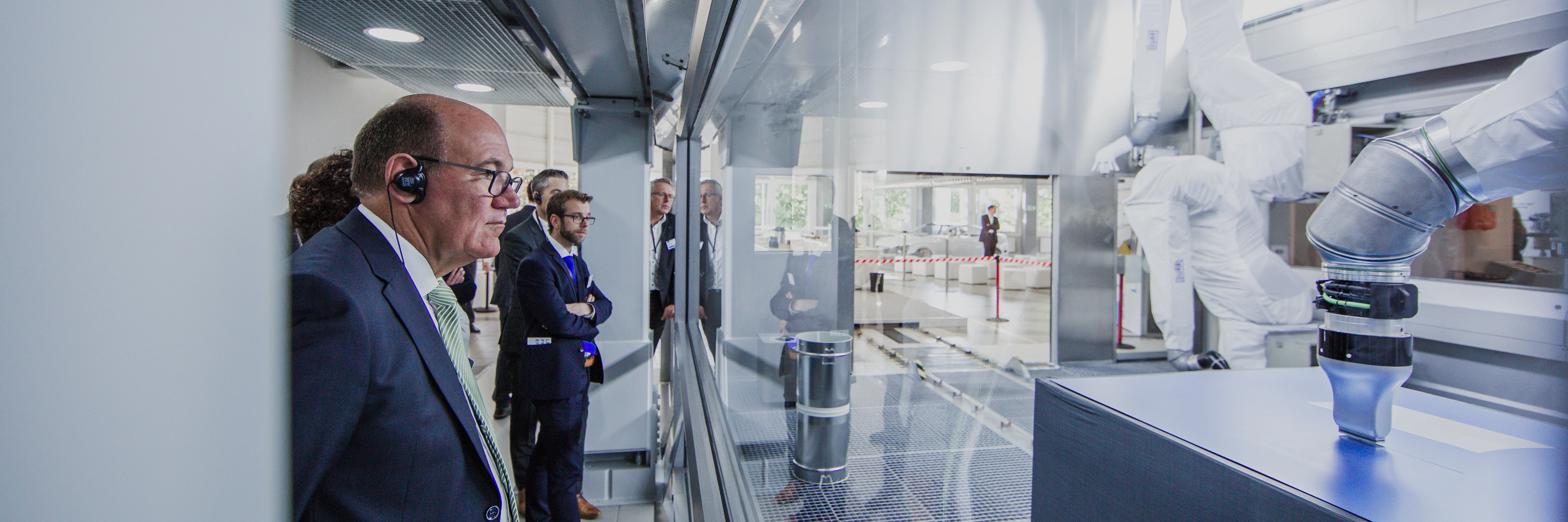 visitors watching overspray-free painting