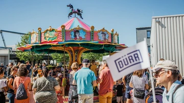 A children’s carousel at the Dürr summer party