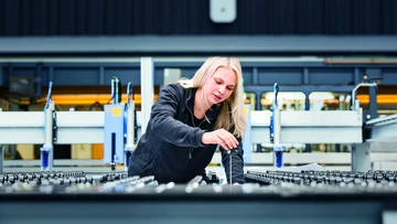 apprentice working on a machine