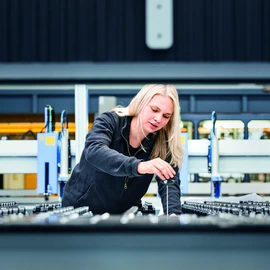 Vocational training apprentice working on a machine