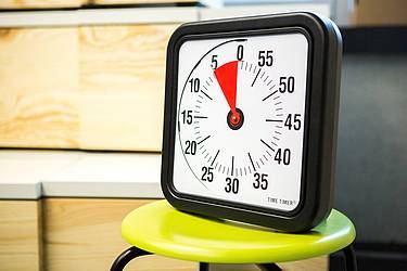The timekeeper is a device that checks the time and looks like a clock.