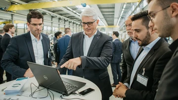 Carlo Crosetto during the digital signing process