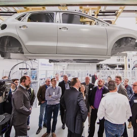 visitors inspect underbody application