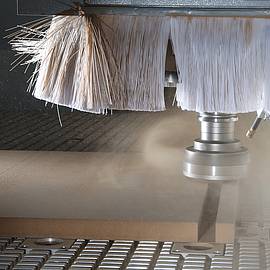 Guiding shavings and dust in the direction of the exhaust system