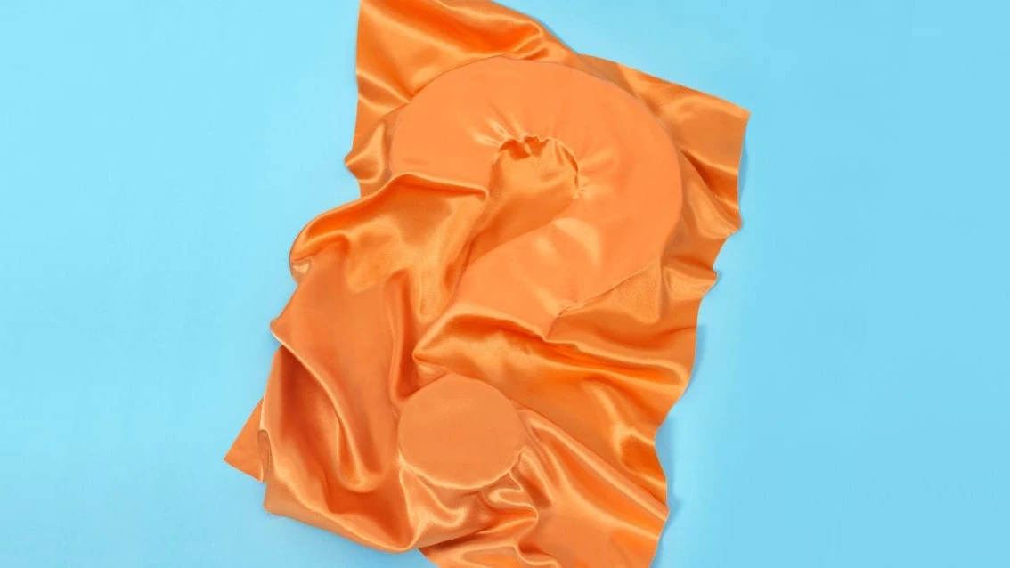 ECO Coverbild Fragezeichen mit orangefarbenem Stoff verdeckt