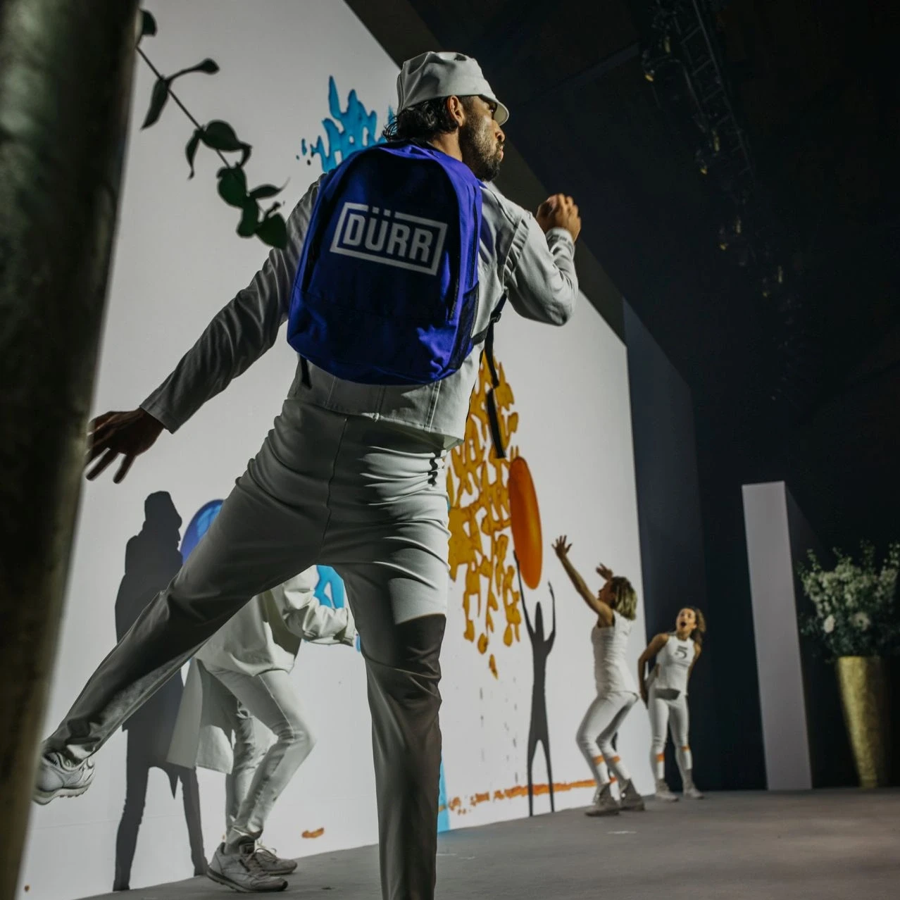 Dancer with Dürr backpack on stage