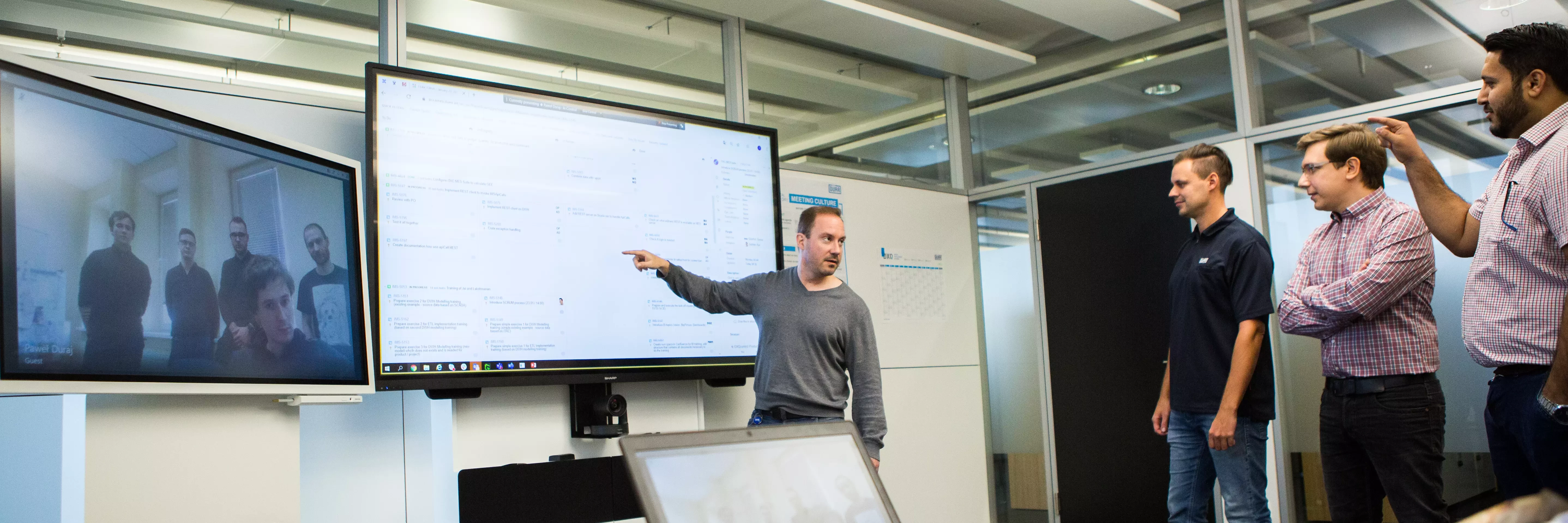 Ilya Zaytsev and other colleagues are doing a video conference.
