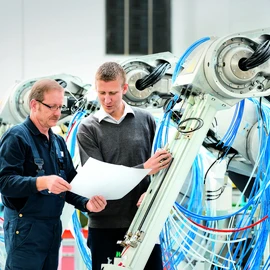 Employees assembly a robot