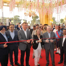 The cutting of the red ribbon for the building opening