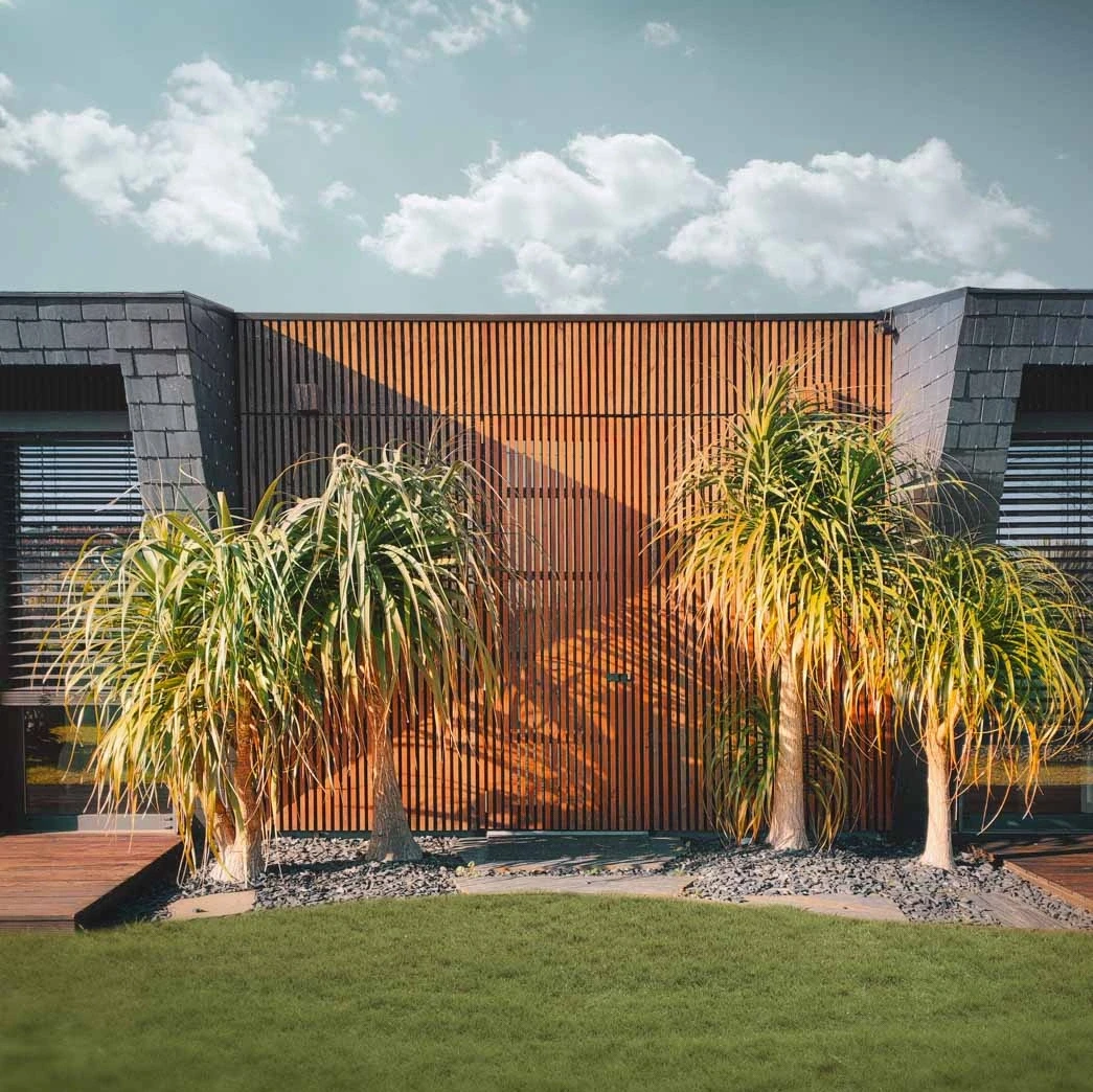 Elegant wooden building with palm trees