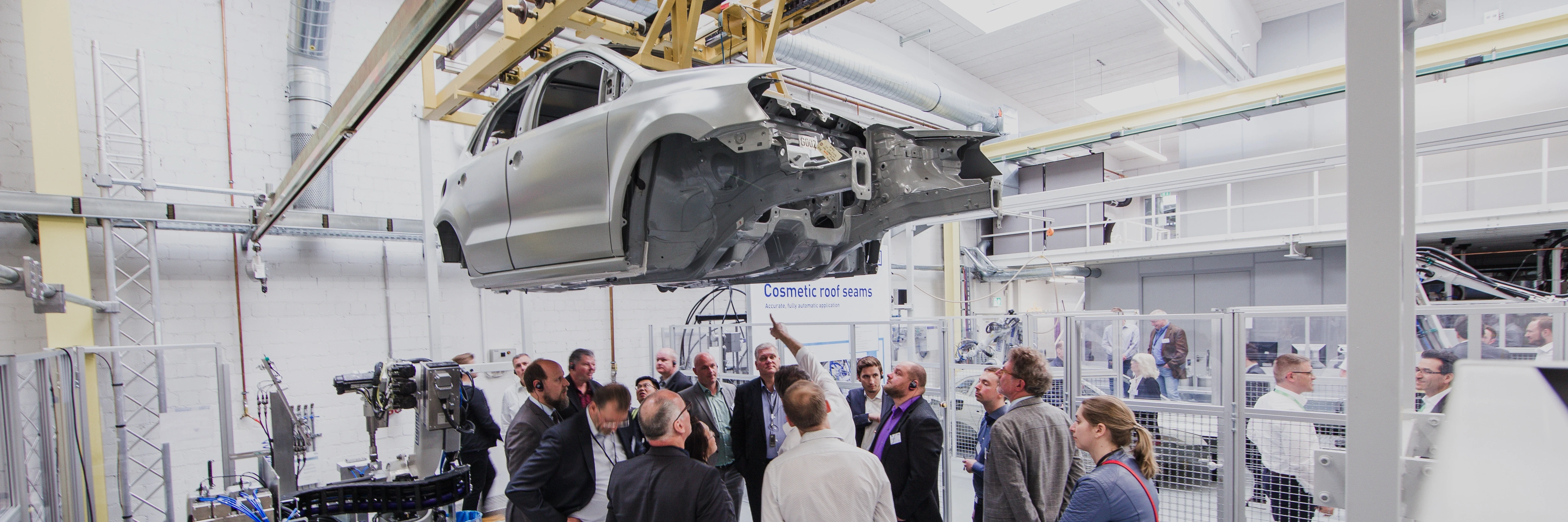 visitors examinating car underbody 